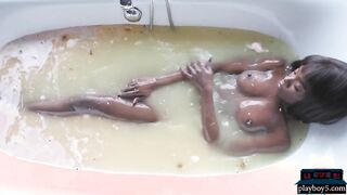 Tall black MILF model Ana Foxxx strips and takes a hot bath
